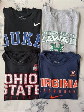 4 Nike college shirts . In very good condition .  Short sleeve